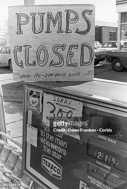 Signs on a Texaco gas pump during the Energy Crisis, when severe oil shortages caused long lines and restrictions at gas stations around the United...