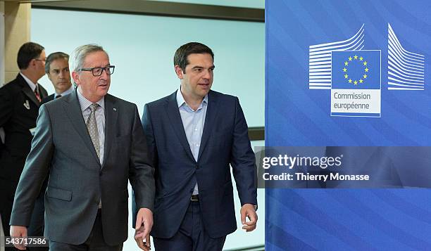 Brussels, Belgium, June 3, 2015. -- European Commission President Jean-Claude Juncker walks with Greek Prime Minister Alexis Tsipras as they arrive...