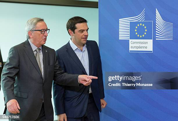 Brussels, Belgium, June 3, 2015. -- European Commission President Jean-Claude Juncker walks with Greek Prime Minister Alexis Tsipras as they arrive...