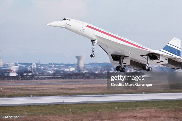 The Concorde takes off from a runway for its first flight.