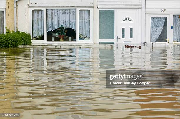 The main street of Toll Bar near Doncaster UK flooded in the June 2007 unprecedented summer floods | Location: Toll Bar near Doncaster, England, UK.