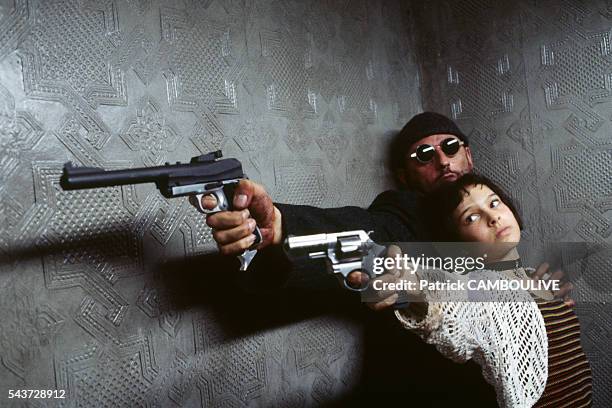 American actress Natalie Portman and French actor Jean Reno on the set of the film "Leon", directed by Luc Besson.