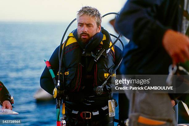 French director, screenwriter and producer Luc Besson on the set of his movie Le Grand Bleu.