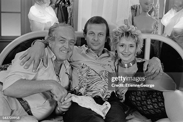 French director Georges Lautner and actors Roland Giraud and Marie-Anne Chazel on the set of Lautner's film La Vie Dissolue de Gerard Floque .