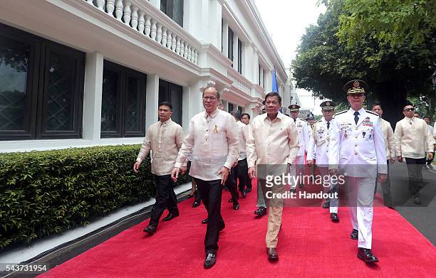 In this handout image provided by Malacanang Photo Bureau, Outgoing President Benigno S. Aquino III bids goodbye after the Departure Honors at the...