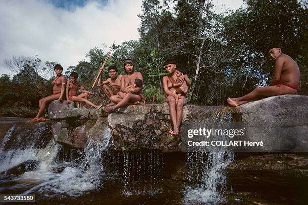 Yanomami indians living close to the Amazon River in Brazil. The Yanomami are an indigenous people of Brazil and Venezuela, living under the...