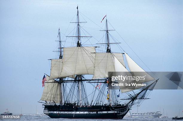 The Navy frigate USS Constitution, nicknamed Old Ironsides, sails along Massachusetts Bay after 116 years at dock.