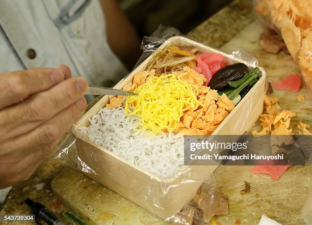 An employee of Maizuru co. Works which a replica food manufactured from vinyl chloride at the company's workshop in Tokyo, Japan, on August 21, 2013....