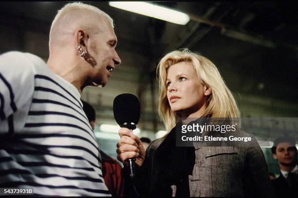 Actress Kim Basinger and French fashion designer Jean-Paul Gaultier on the set of the film Prêt-à-Porter, , directed by American director Robert...