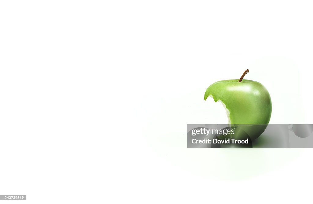 Apple with a bite taken out of it.