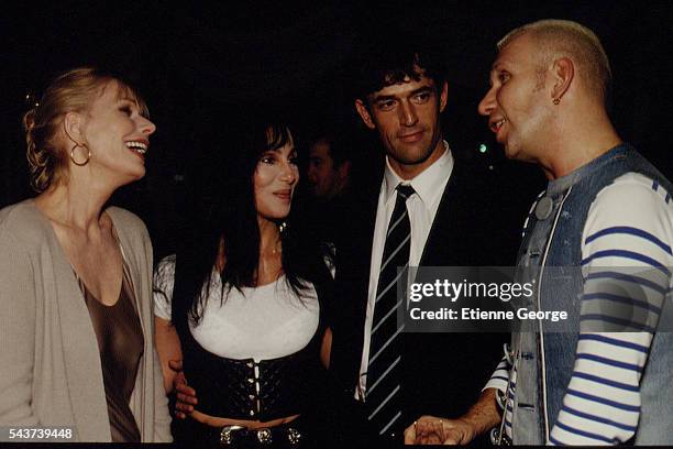 Actresses Sally Kellerman, Cher, also singer, English actor Rupert Everett and French fashion designer Jean-Paul Gaultier on the set of the film...
