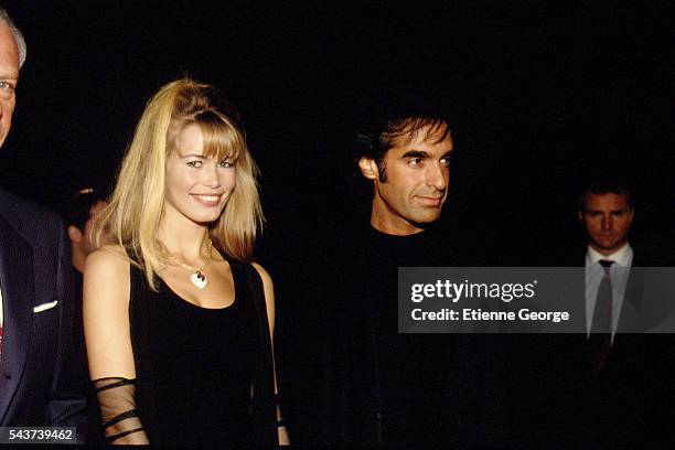 German Fashion model Claudia Schiffer and American magician and illusionist David Copperfield on the set of the film Prêt-à-Porter, , directed by...