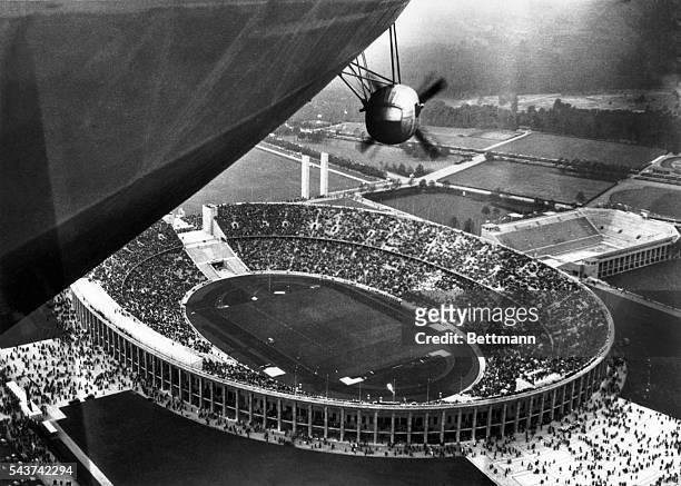 An excellent aerial view of the Olympic stadium, made from the giant German dirigible Hindenburg, nearly 100,000 persons were in the stadium when the...