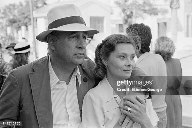 French actors Philippe Noiret and Macha Méril on the set of the film "Le Grand carnaval" , directed by Alexandre Arcady.