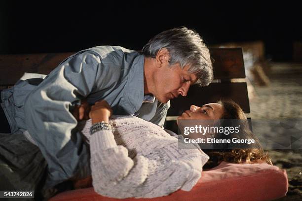 French actors Valerie Kaprisky and Jacques Perrin on the set of the film "L'Annee des meduses" , directed by English director Christopher Frank and...