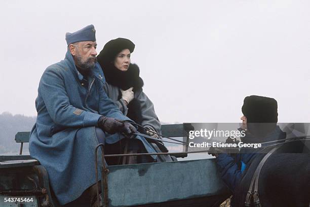 French actors Philippe Noiret and Sabine Azema directed by Bertrand Tavernier on the set of the film "La Vie et rien d'autre" , for which Noiret won...