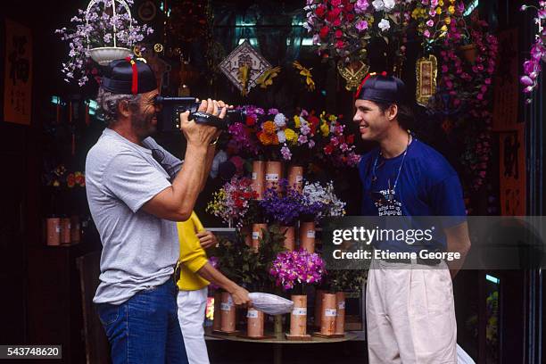 Actor Jean-Paul Belmondo filming his son, the actor Paul Belmondo, on the set of "Itineraire d'un enfant gate" , directed by Claude Lelouch. Belmondo...