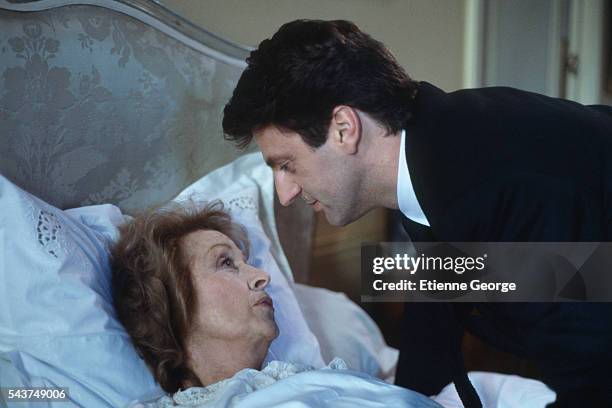 French actors Danielle Darrieux and Daniel Auteuil on the set of "Quelques jours avec moi," directed by Claude Sautet , based on Jean-François...