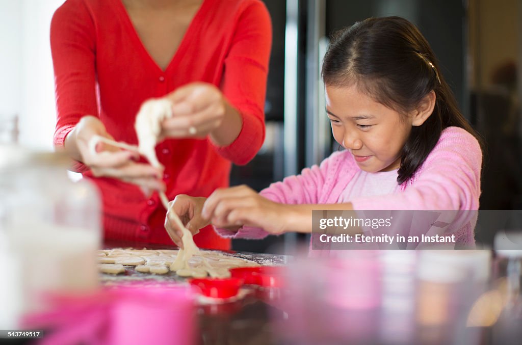 Young girl making cookies with cookie dough