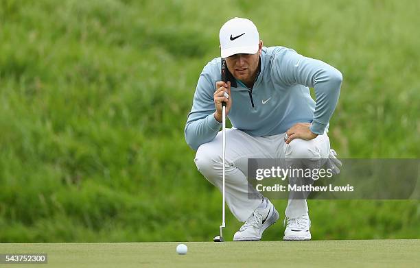 Lucas Bjerregaard of Denmark lines up a putt during day one of the 100th Open de France at Le Golf National on June 30, 2016 in Paris, France.