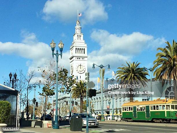 san francisco ferry building and street car - midday stock pictures, royalty-free photos & images