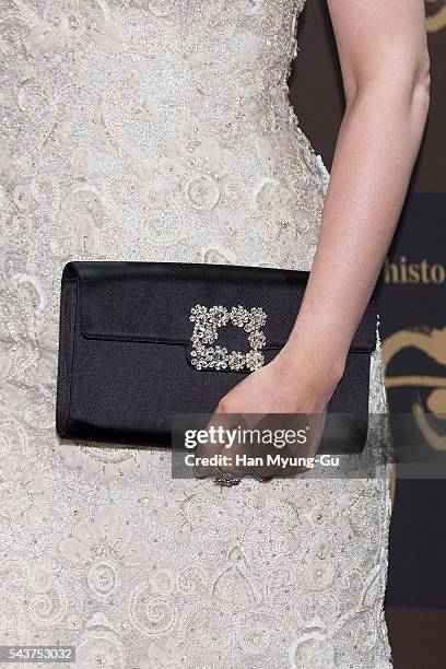 South Korean actress Lee Young-Ae, bag detail, attends the photocall for the LG Household and Health Care "The History Of Whoo" Launch Party at Four...