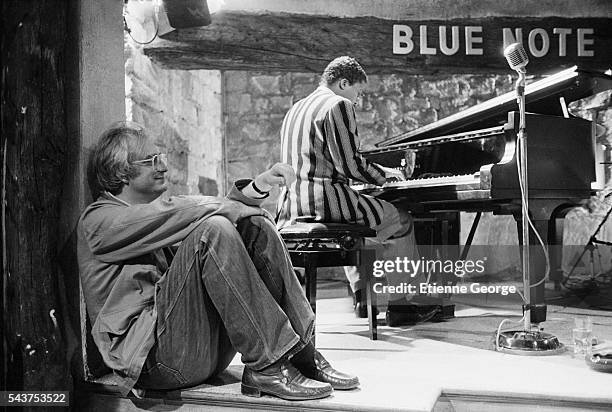 French director Bertrand Tavernier listening to American jazz pianist and composer Herbie Hancock on the set of "Round Midnight" , based on the David...