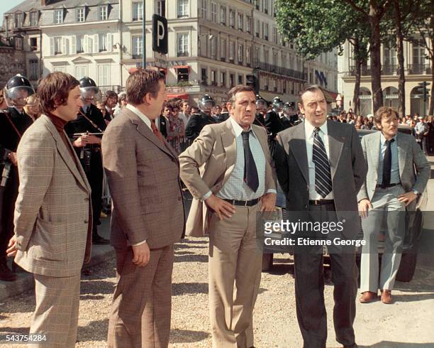 French actor Pierre Tornade, Italian-born actor Lino Ventura, French actors Julien Guiomar and Patrick Dewaere on the set of "Adieu, Poulet", ,...
