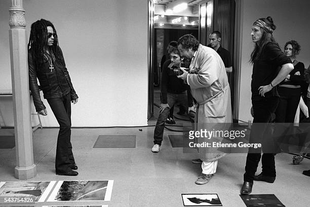 American artist, painter and director Julian Schnabel photographs American musician Lenny Kravitz with Michael Wincott on the set of his film "Le...