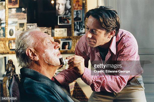 Swedish actor Max von Sydow and French actor Mathieu Amalric on the set of the film "Le Scaphandre et le Papillon" , directed by American artist,...