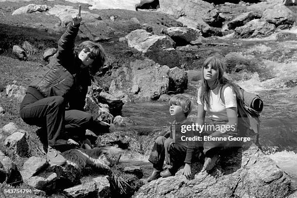 French director Nadine Trintignant on the set of her film "Premiere Voyage" with her children, actor Vincent and actress Marie . The children's...