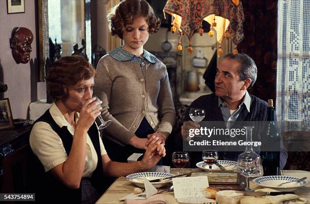 French actors Stephane Audran, Isabelle Huppert, and Jean Carmet on the Set of the Film "Violette Noziere", directed by French director Claude...