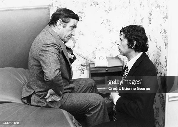 Italian-born French actor Lino Ventura and Belgian singer and actor Jacques Brel on the set of "L'Emmerdeur", directed by Edouard Molinaro and based...