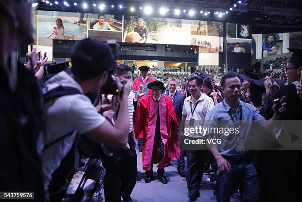 China's former NBA star Yao Ming and Chinese entrepreneur Li Ka-shing attend graduation ceremony of Shantou University on June 30, 2016 in Shantou,...