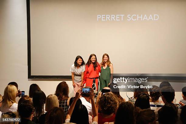 Designer Tutia Schaad, actress Hannah Herzsprung and designer Johanna Perret are seen on stage after the Perret Schaad show during the Mercedes-Benz...