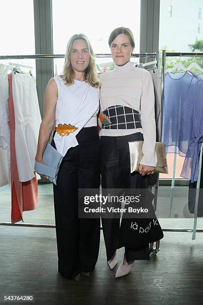 Nele Mueller-Stoefen and Fritzi Haberlandt attend the Perret Schaad show during the Mercedes-Benz Fashion Week Berlin Spring/Summer 2017 at Stage at...