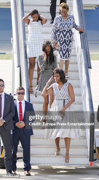 First Lady Michelle Obama, her mother Marian Shields Robinson and her daughters Malia Obama and Sasha Obama arrive at Torrejon Air Force Base on June...