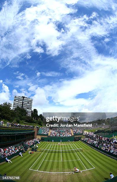 General view of action between Aliaksandra Sasnovich and Kristina Mladenovic of France on court 18 on day four of the Wimbledon Lawn Tennis...