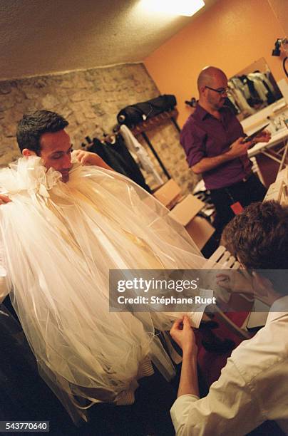 Preparation of the show: Jean Paul Knott tries on a doublet.