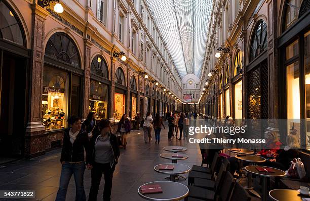 Brussels, Belgium, July 1; 2012. -- Tourists enjoy the Galeries Royales Saint-Hubert. The Galeries Royales Saint-Hubert designed by the young...