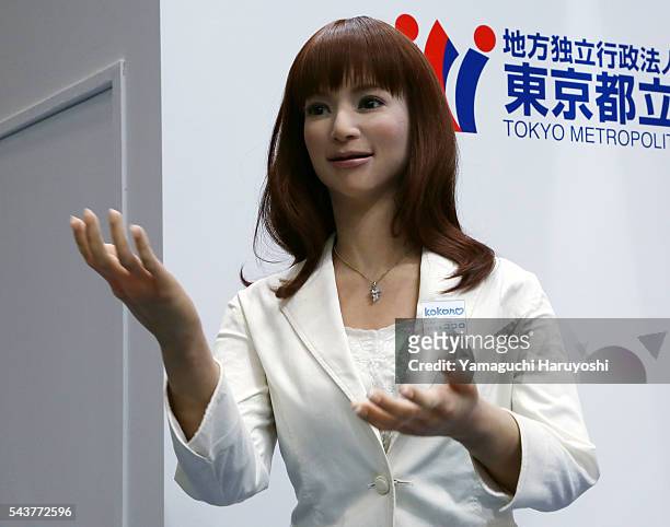 Kokoro, the Actroid humanoid robot draws visitors attentions during the International Robot Exhibition started in Tokyo on Wednesday, December 2,...