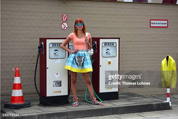 Sussan Zeck is wearing a jacket by Christian Pellizzari, a skirt bei HOPPER, a bag and bracelet by Marc Cain and shoes by Moda Espana during the...