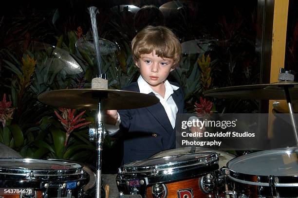 View of Barron Trump as he plays the drums during a Valentine's Day event, February 14, 2009.