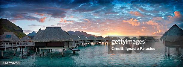 hilton resort, bungalows, tahiti - tahiti stock pictures, royalty-free photos & images