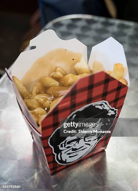 Toronto, Canada, December 28, 2015. -- Poutine is a Canadian dish, originating in the province of Quebec, made with french fries and cheese curds...