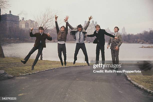 English group The Dave Clark Five leap in the air from a path in Central Park, New York on 4th March 1964. From left to right: Rick Huxley, Denis...