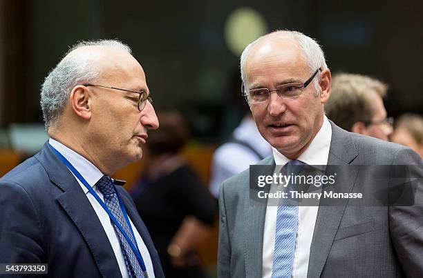 Brussels, Belgium, September 30; 2013. -- French Permanent representative Philippe ETIENNE is talking with the French Minister for European Affairs...