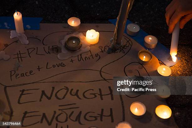 Vigil participants light candles and write messages of solidarity.. On the evening following the suicide bombing attack at Istanbul's Ataturk...