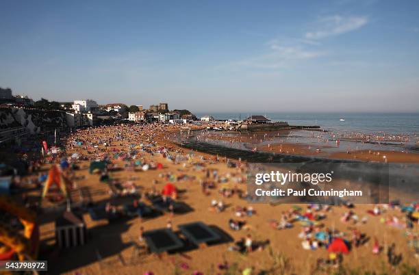 a busy sandy beach - beach resort stock pictures, royalty-free photos & images