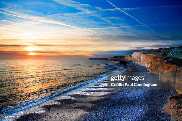 the seven sisters cliffs at sunset - bathing in sunset stockfoto's en -beelden